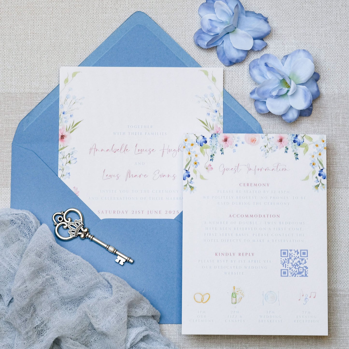 Wedding invitations with blue wildflower watercolour painterly-style, with dusty blue envelopes