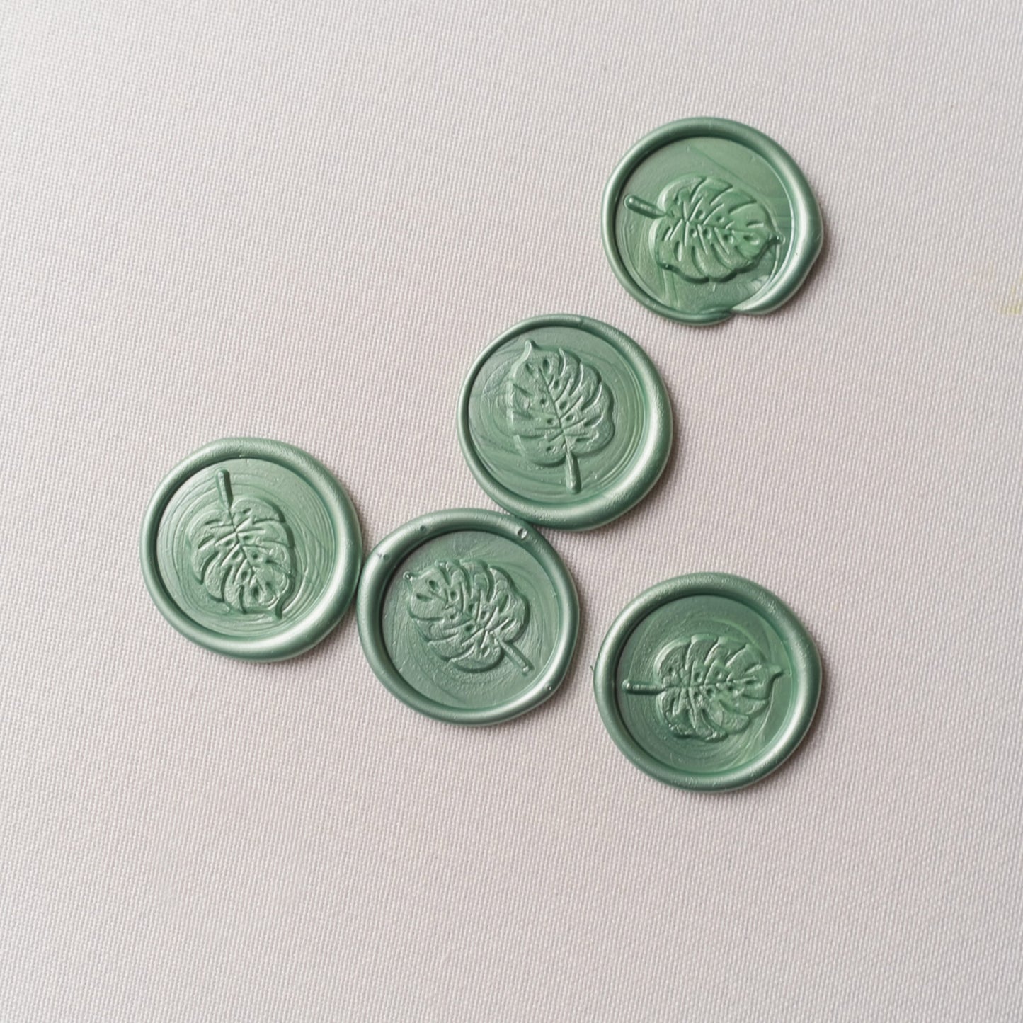 wax seals with montserrat leaf