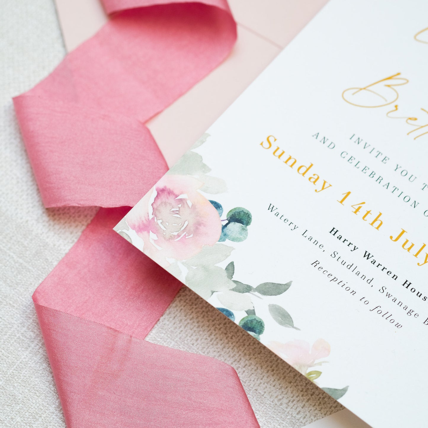 Wedding invitations in pink, sage green and gold, with painterly roses