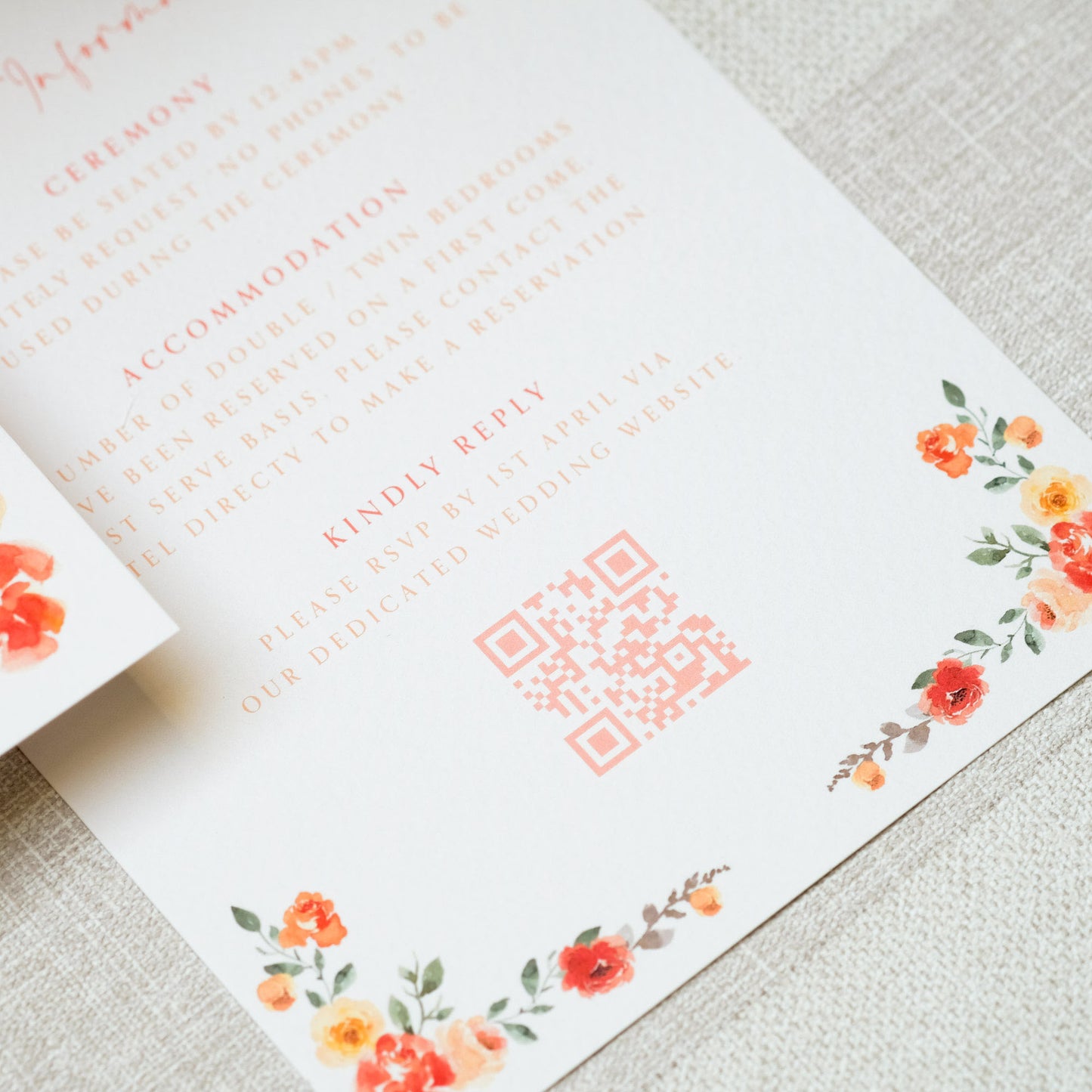 Orange wedding invitation with painterly style floral corners and custom QR code for guests to RSVP