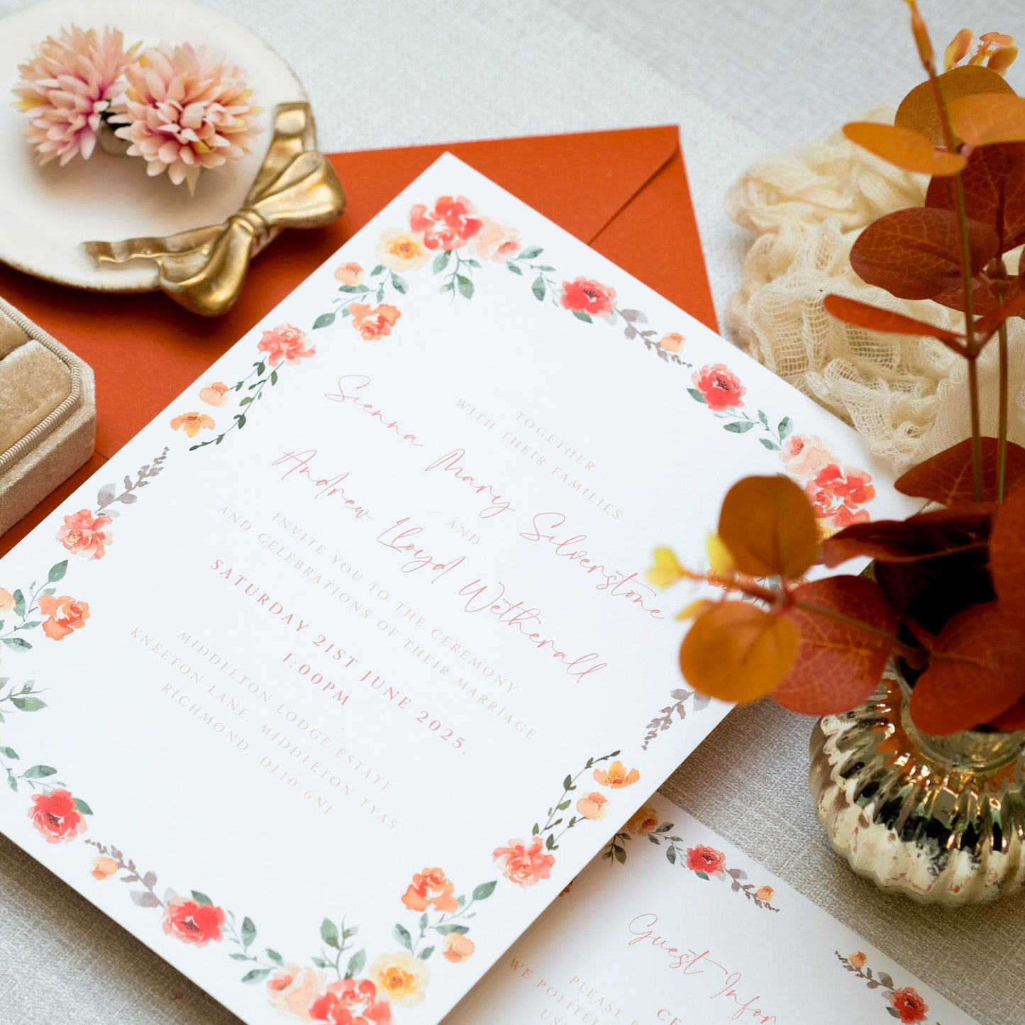 Autumnal orange wedding invitation with orange floral border and orange text