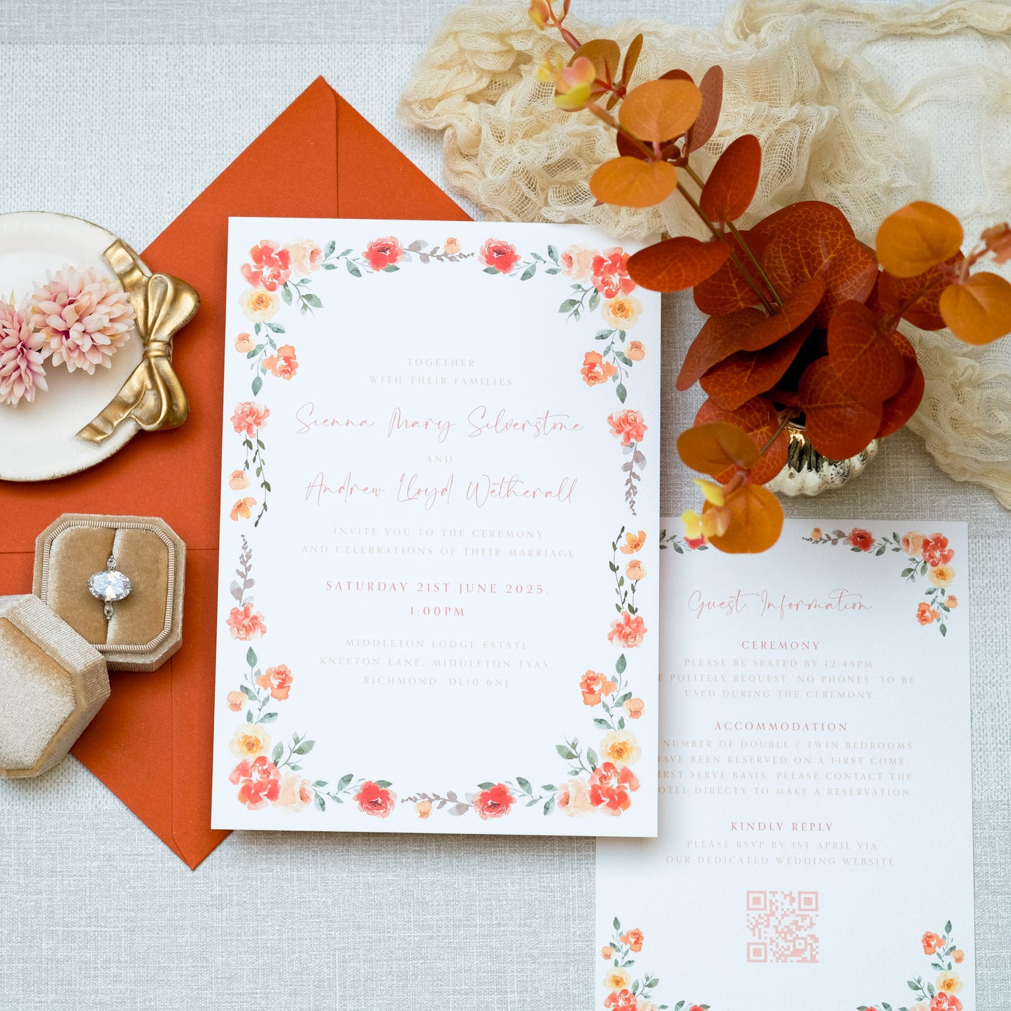 Wedding invitation with border of orange flowers, with orange font and orange envelope