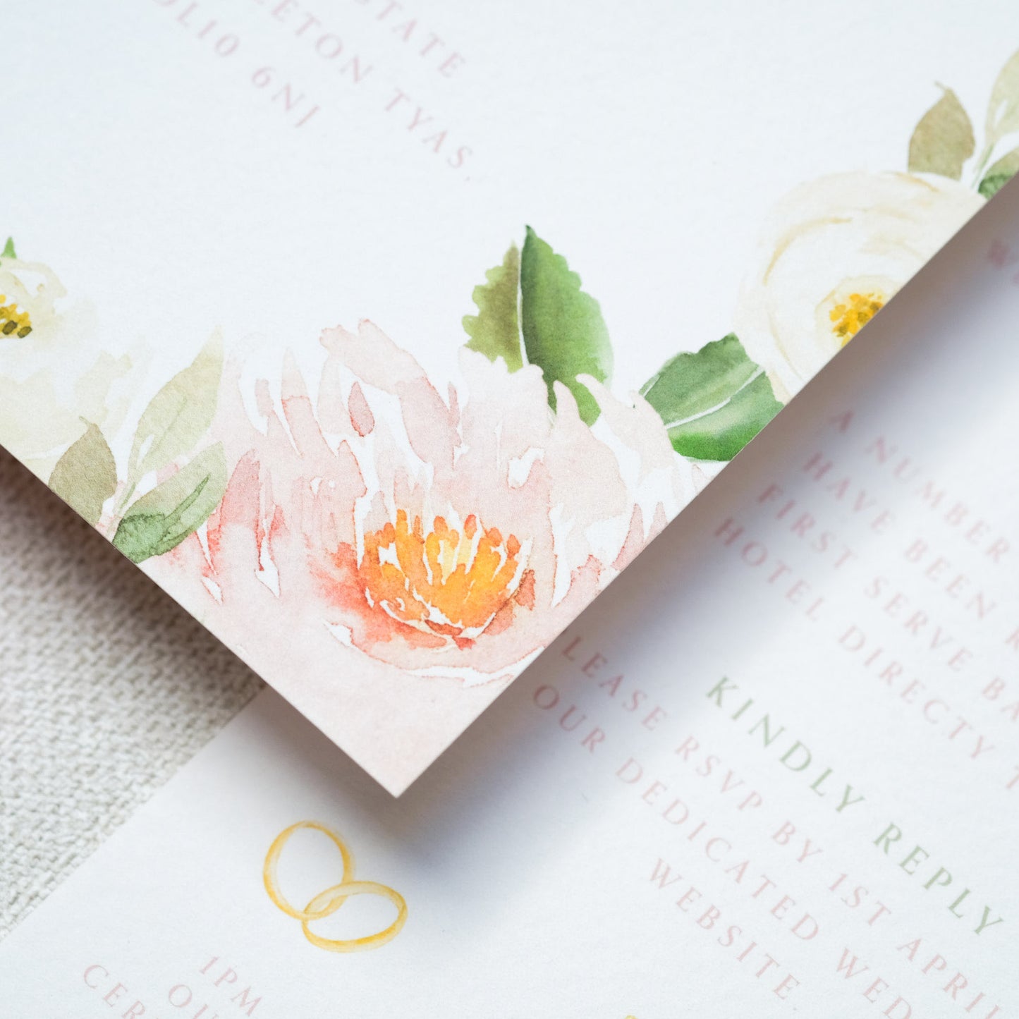 Close up of painterly-style, watercolour peonies on wedding invite