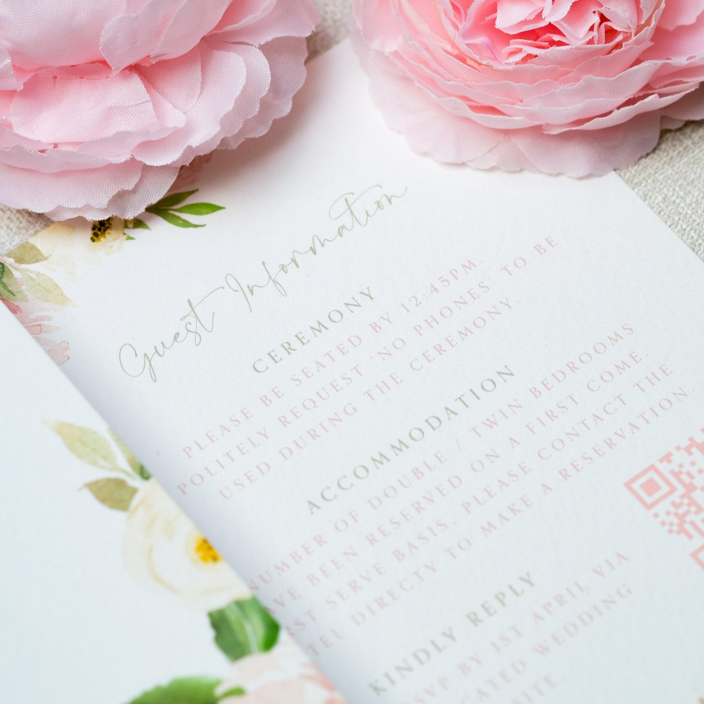 Wedding invite with guest information and pink blush peony details