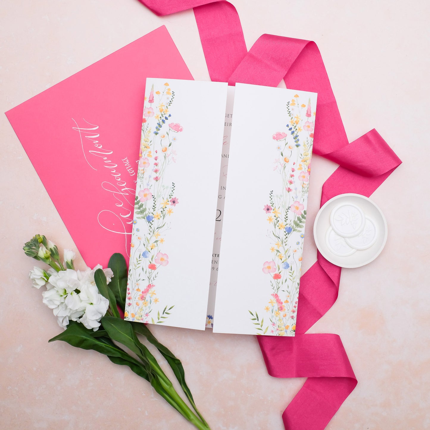 Wildflower folded wedding invitation with colourful illustration