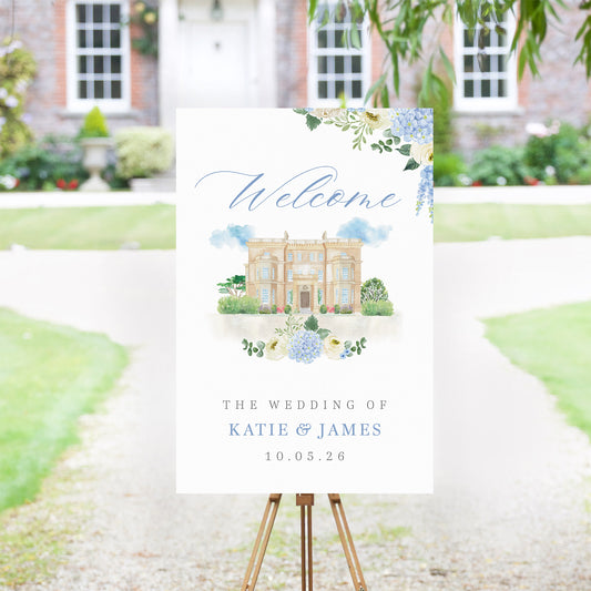 Wedding welcome sign with watercolour venue illustration and blue hydrangea details
