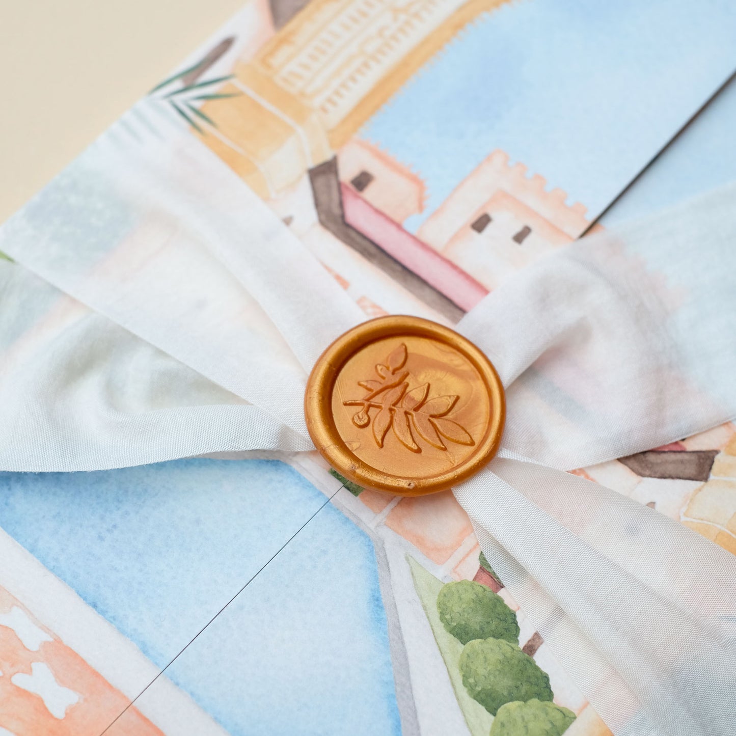Gold wax seal with botanical leaf stamp