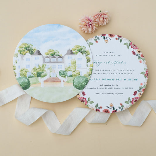 Round wedding invitation with watercolour illustration of Achnagairn Castle and burgundy florals