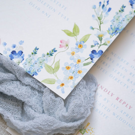 Blue wildflower hand illustrated wedding invitation, floral border