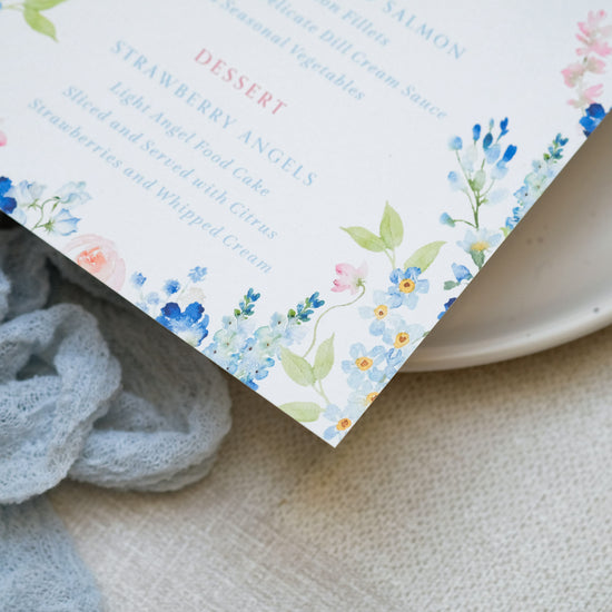 Blue floral wedding menu with guest name