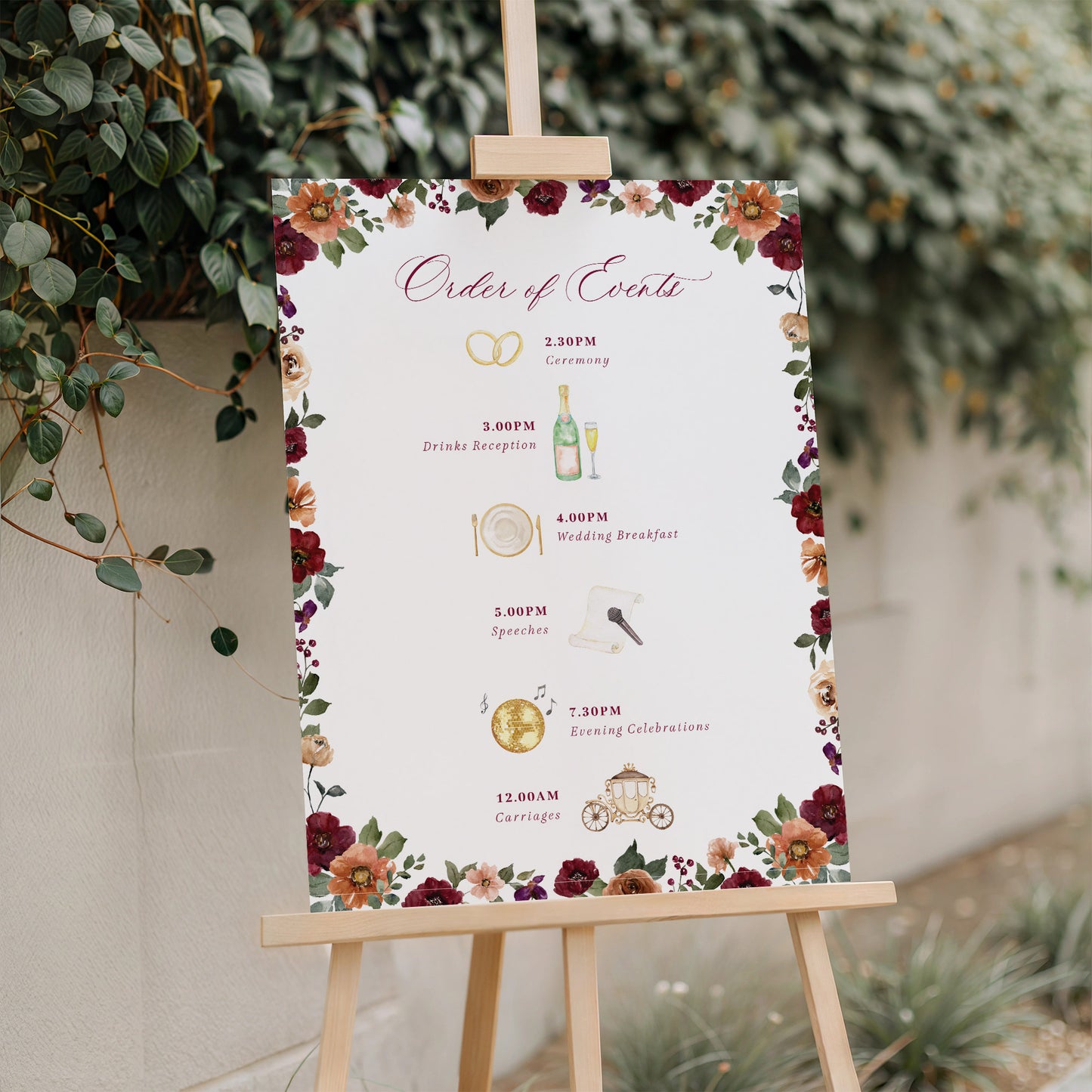 wedding order of events sign with autumnal burgundy orange flowers
