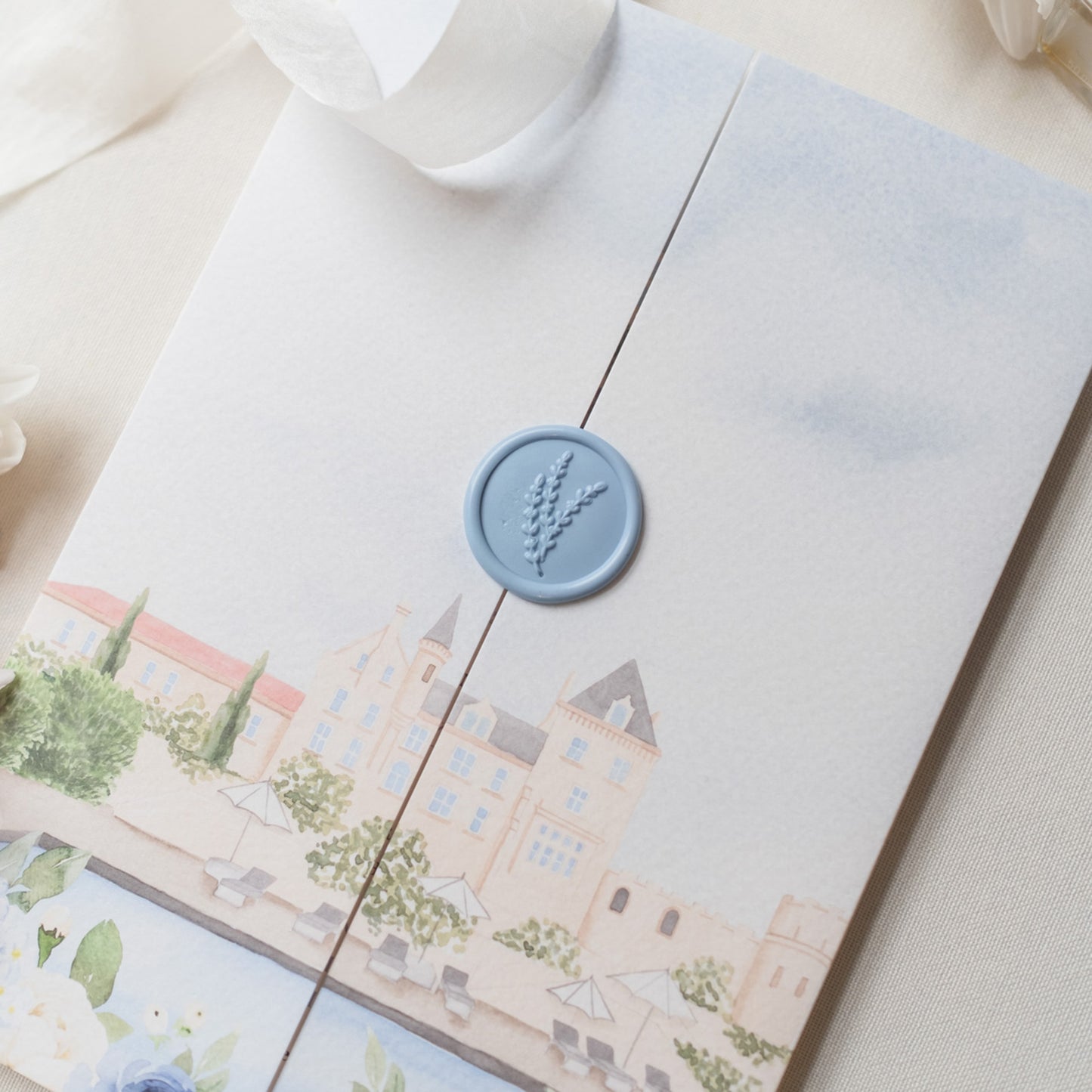 Blue chateau folded wedding invitation with blue wax seal