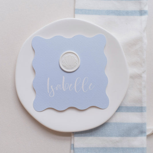 Wavy shaped place cards with shell wax seal