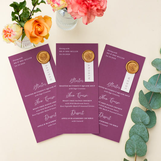burgundy wedding menu personalised with guest name and wax seal keepsake placecard