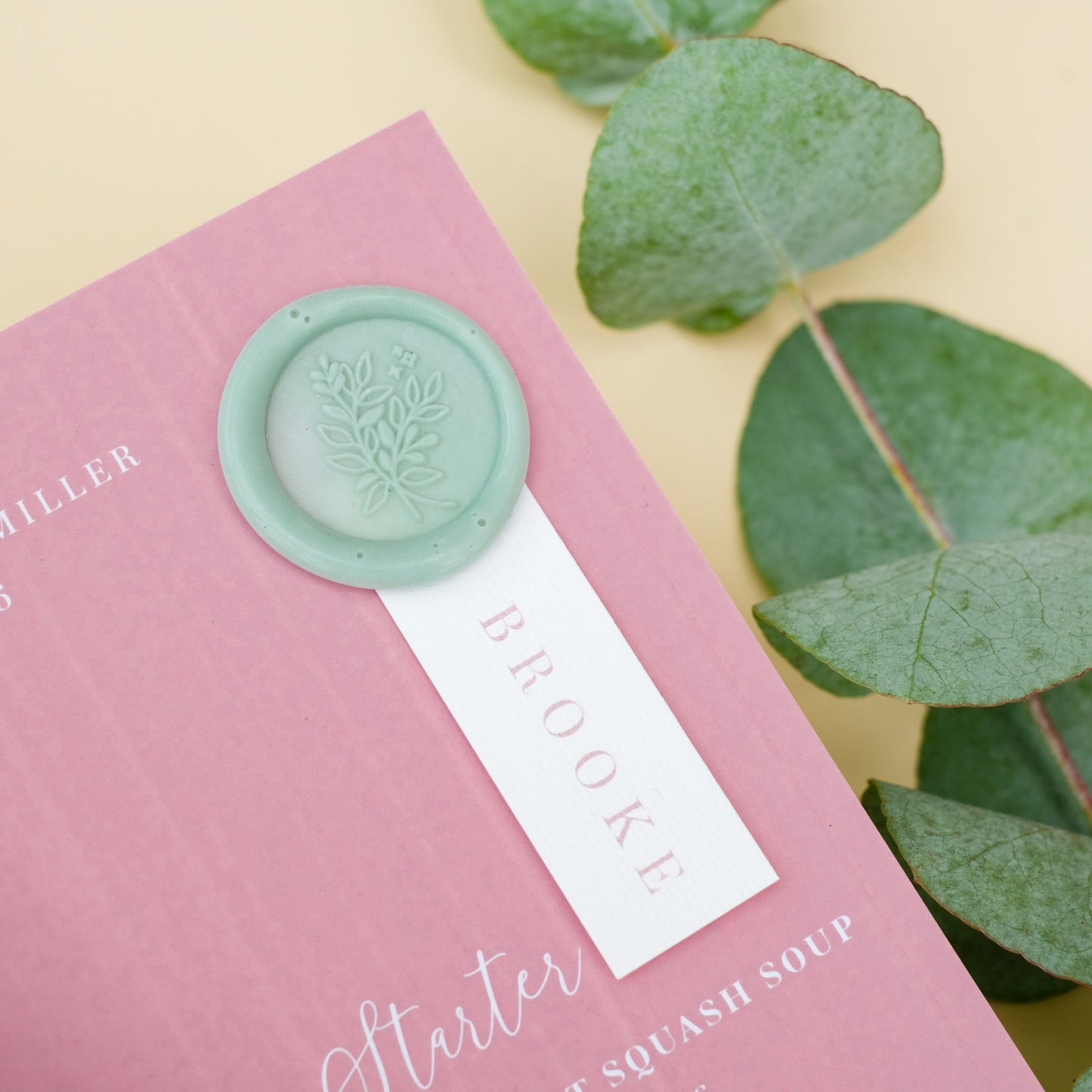 dusty rose pink wedding menu with wax seal and guest name