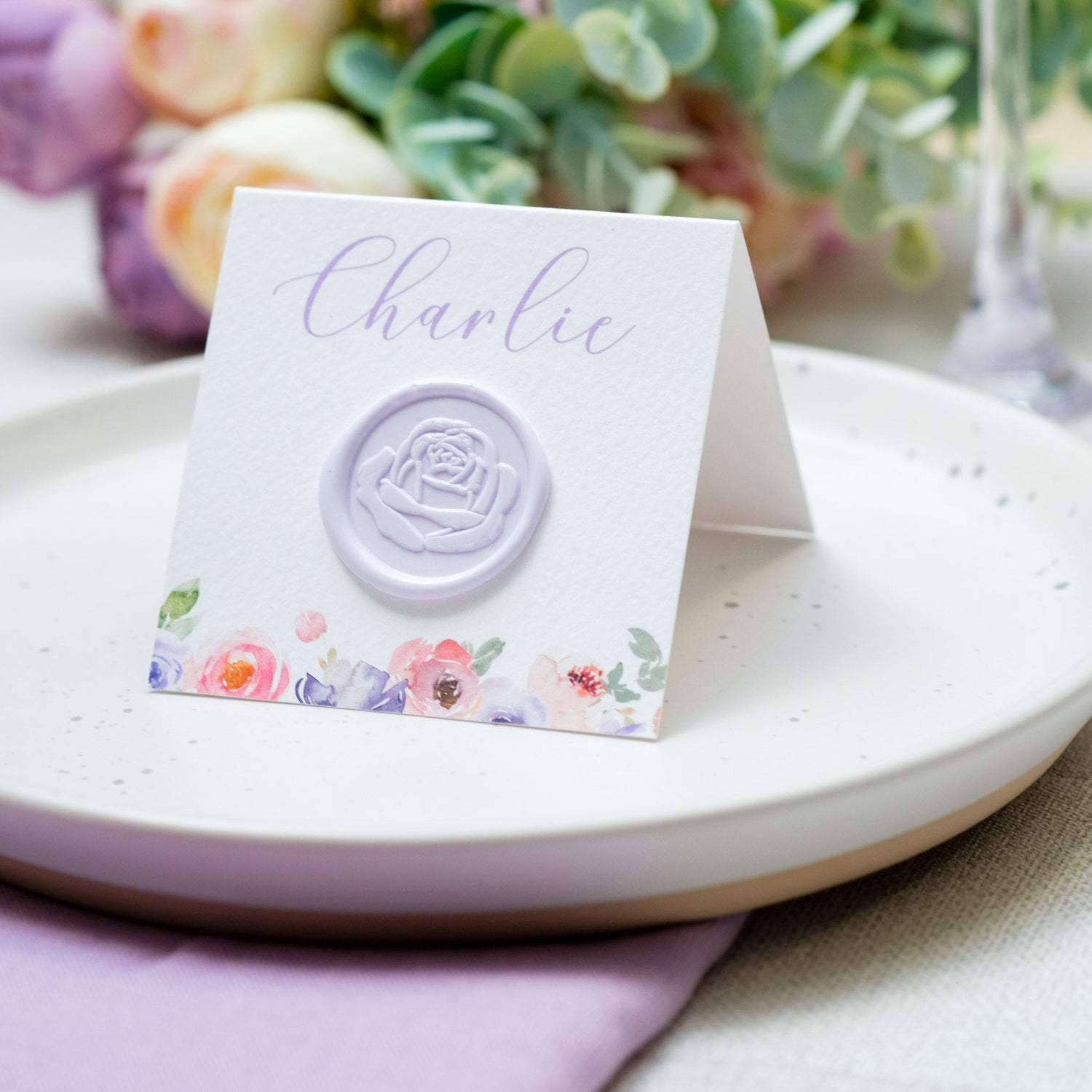 Custom place cards with lilac flowers and wax seals