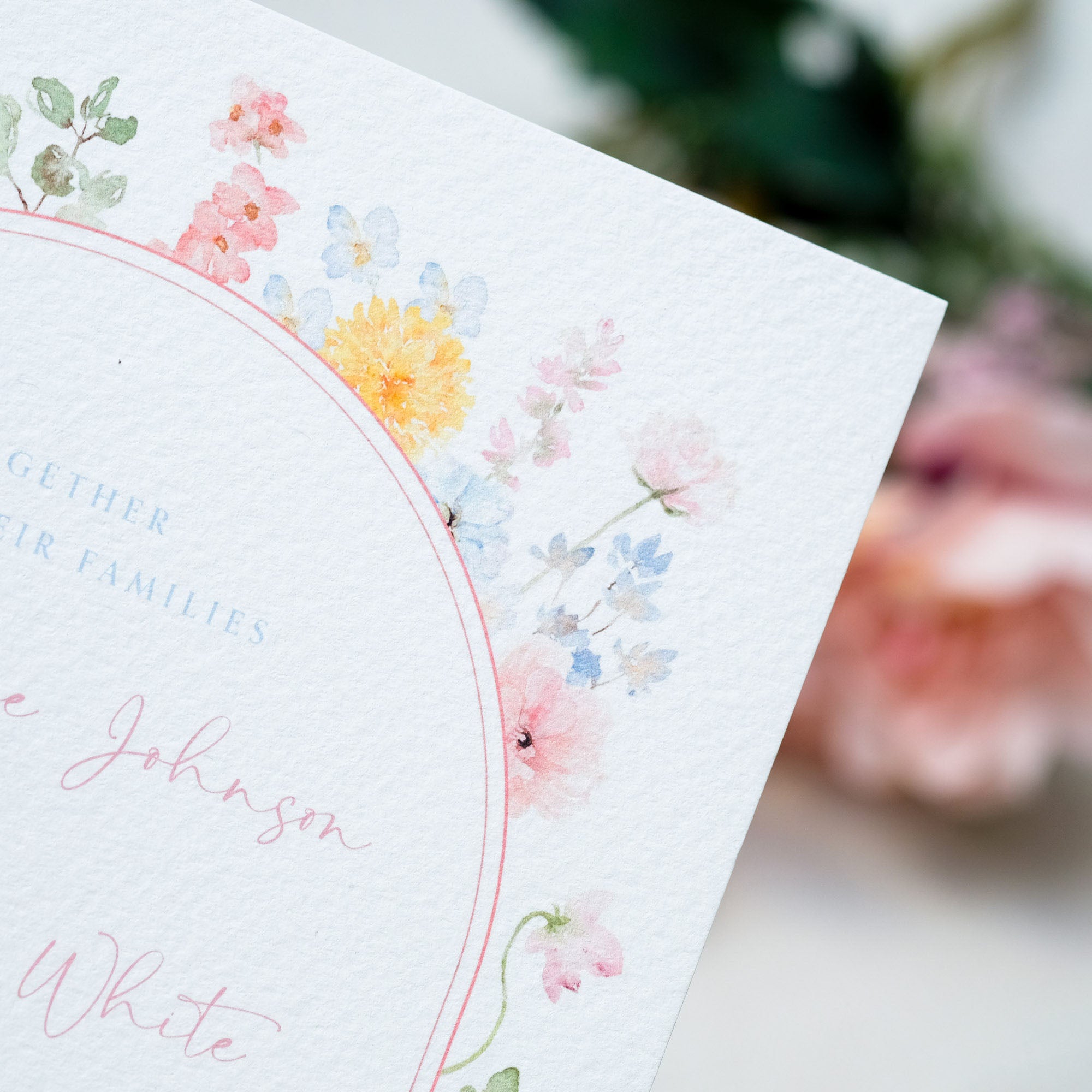 whimsical wildflower illustrated wedding invitation in pastel colours