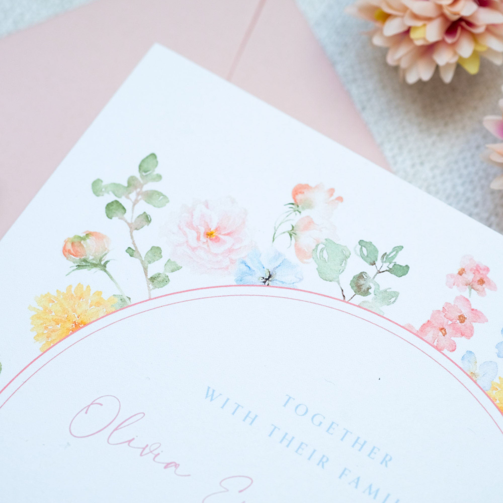 Wildflower wedding invitation with pink, yellow, and blue watercolour wildflowers