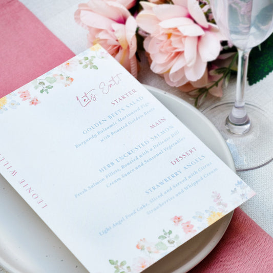 Pink wildflower wedding menu with guest name