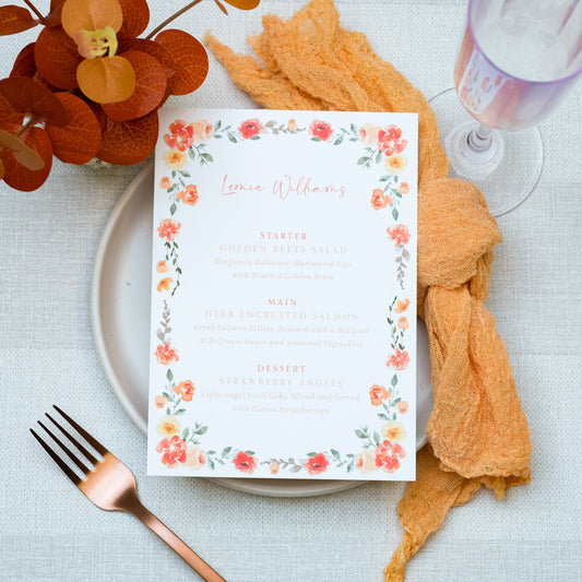 Autumnal wedding menu with orange flower border and orange napkin place setting