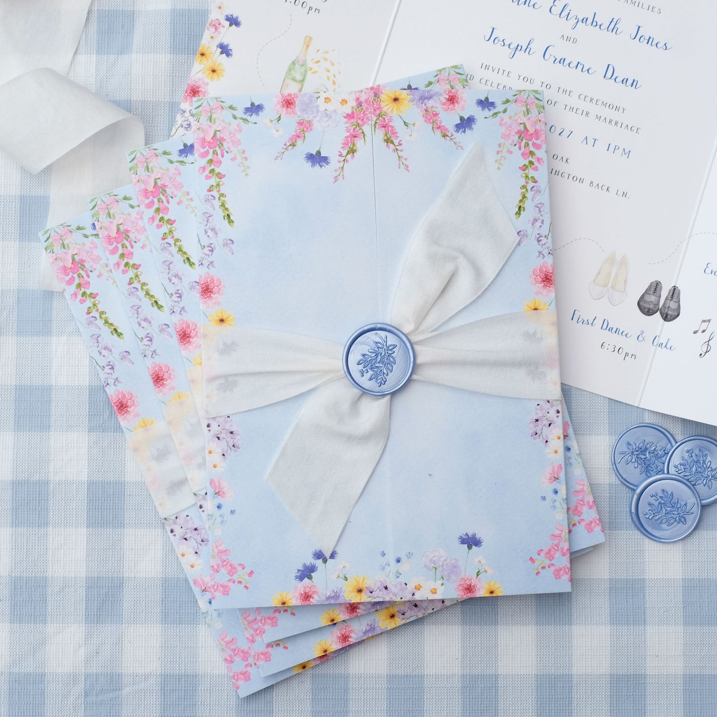 wildflower wedding invitation with ribbon and wax seal