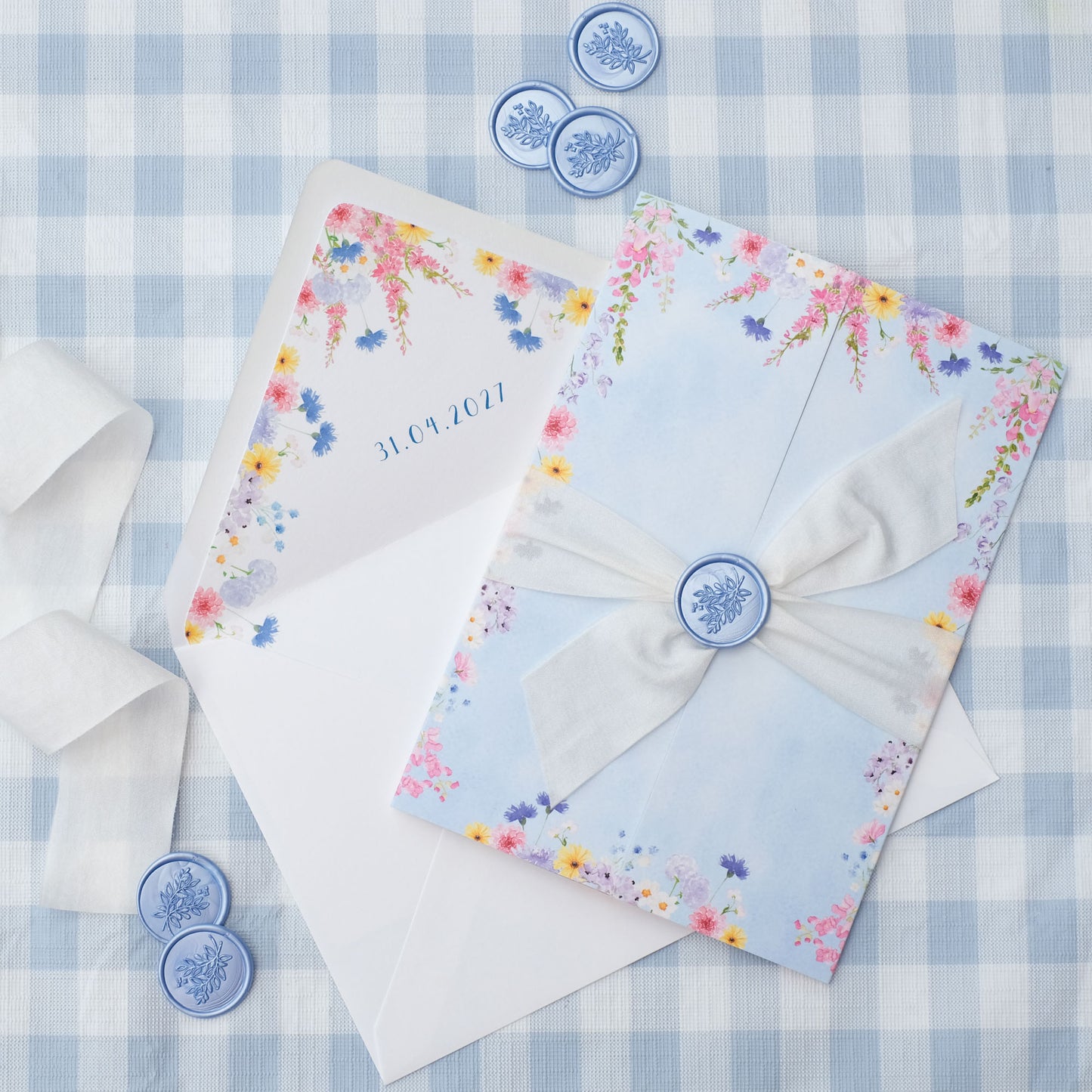 wildflower wedding invitation with ribbon and wax seal