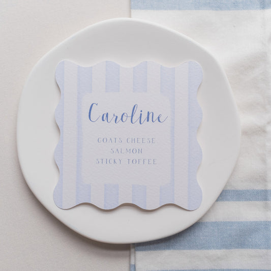 Blue wavy shaped place cards with stripes