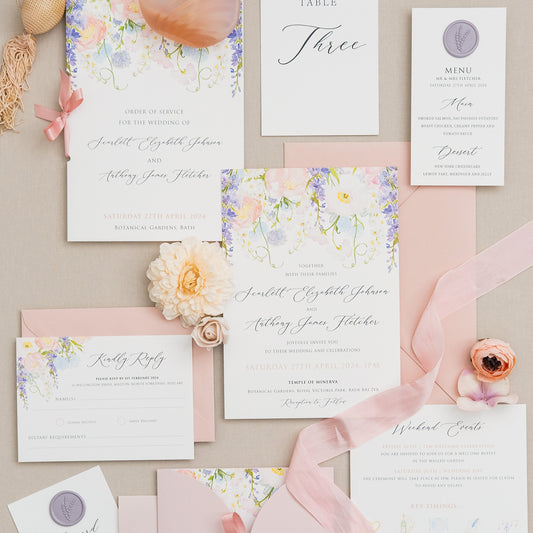 Illustrated wedding invitations with wisteria and wildflowers
