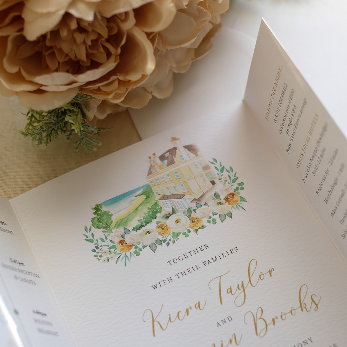 Folded wedding invitation with venue illustration 